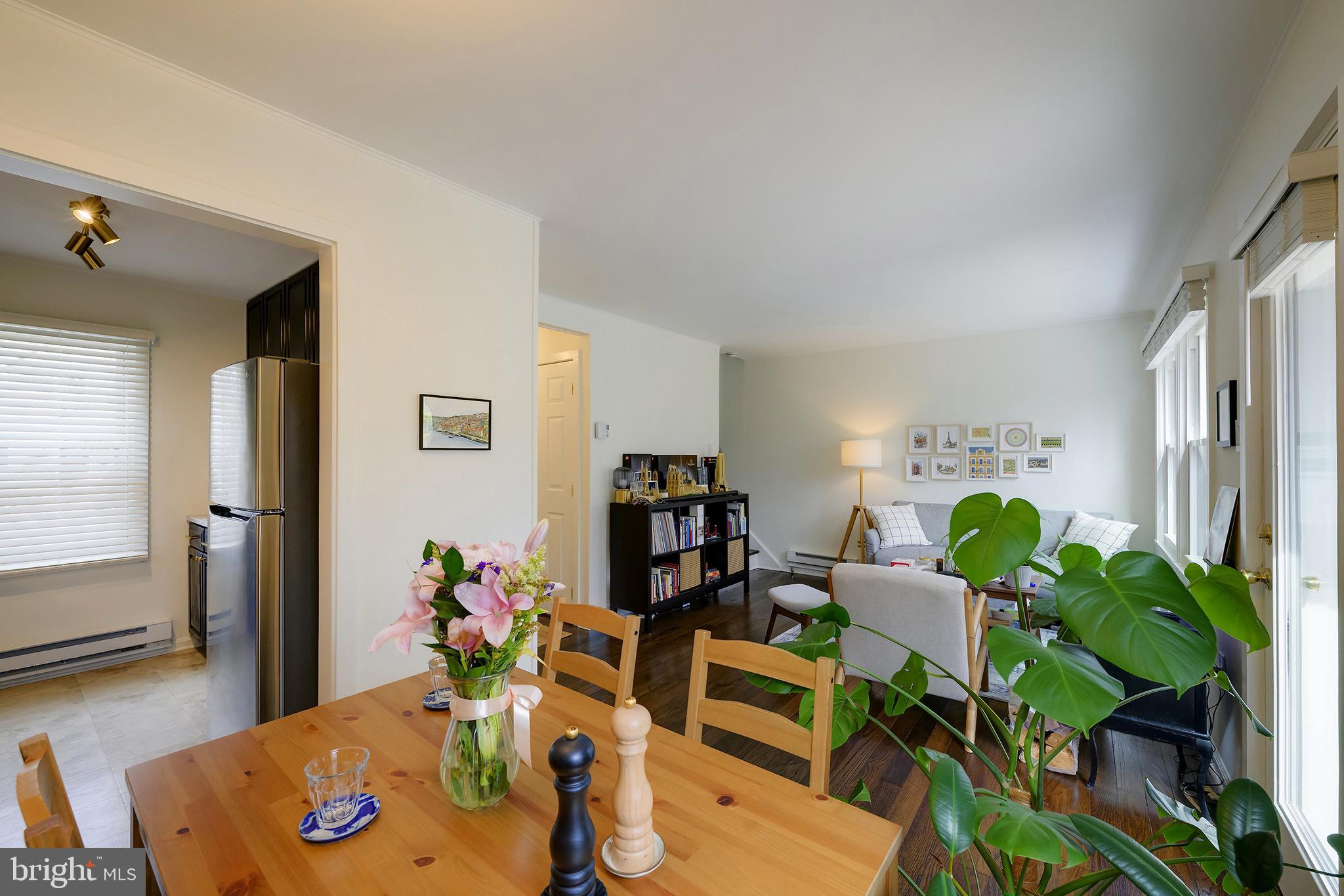14 Laurel Hill Road Greenbelt, MD 20770 - Photo 13 of 41 a living room with furniture potted plant and a wooden floor