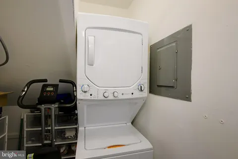 a bathroom with a toilet and a mirror