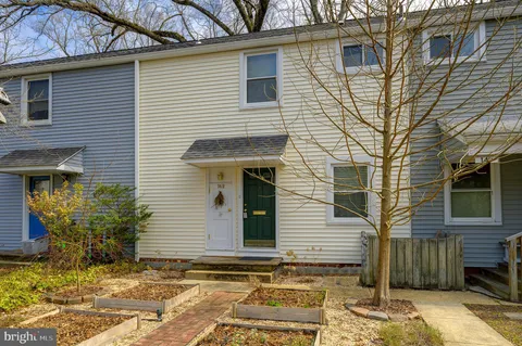 a view of a house with a window and yard