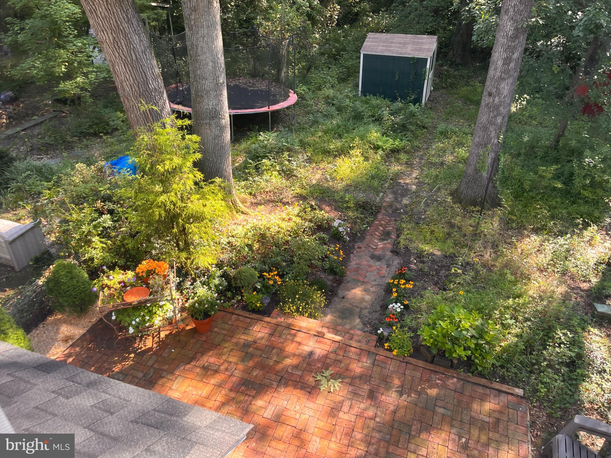 14 Laurel Hill Road Greenbelt, MD 20770 - Photo 31 of 41 a backyard of a house with lots of green space