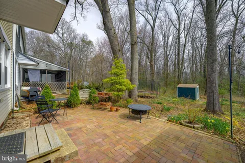 a backyard of a house with outdoor seating