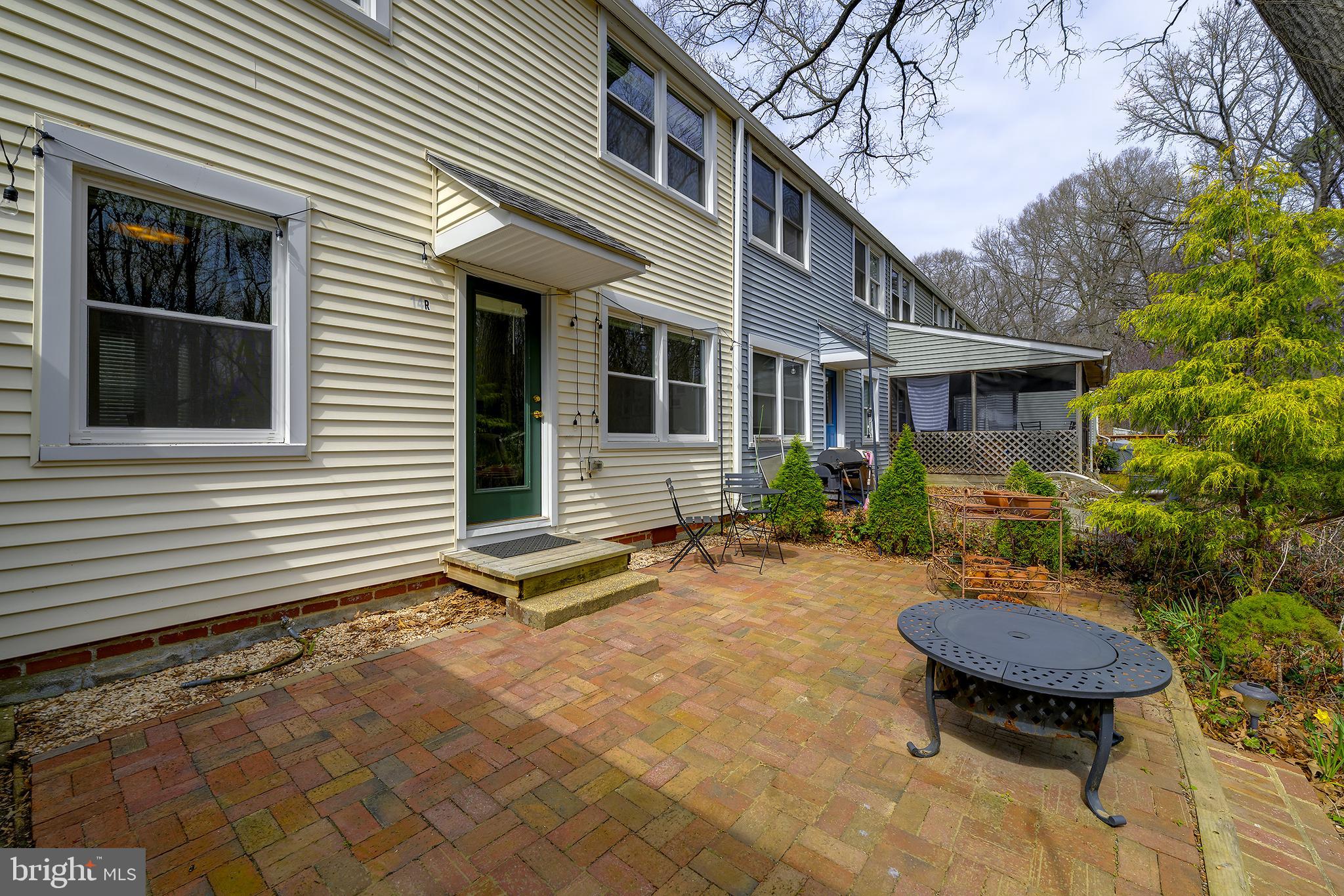 14 Laurel Hill Road Greenbelt, MD 20770 - Photo 34 of 41 a backyard of a house with table and chairs