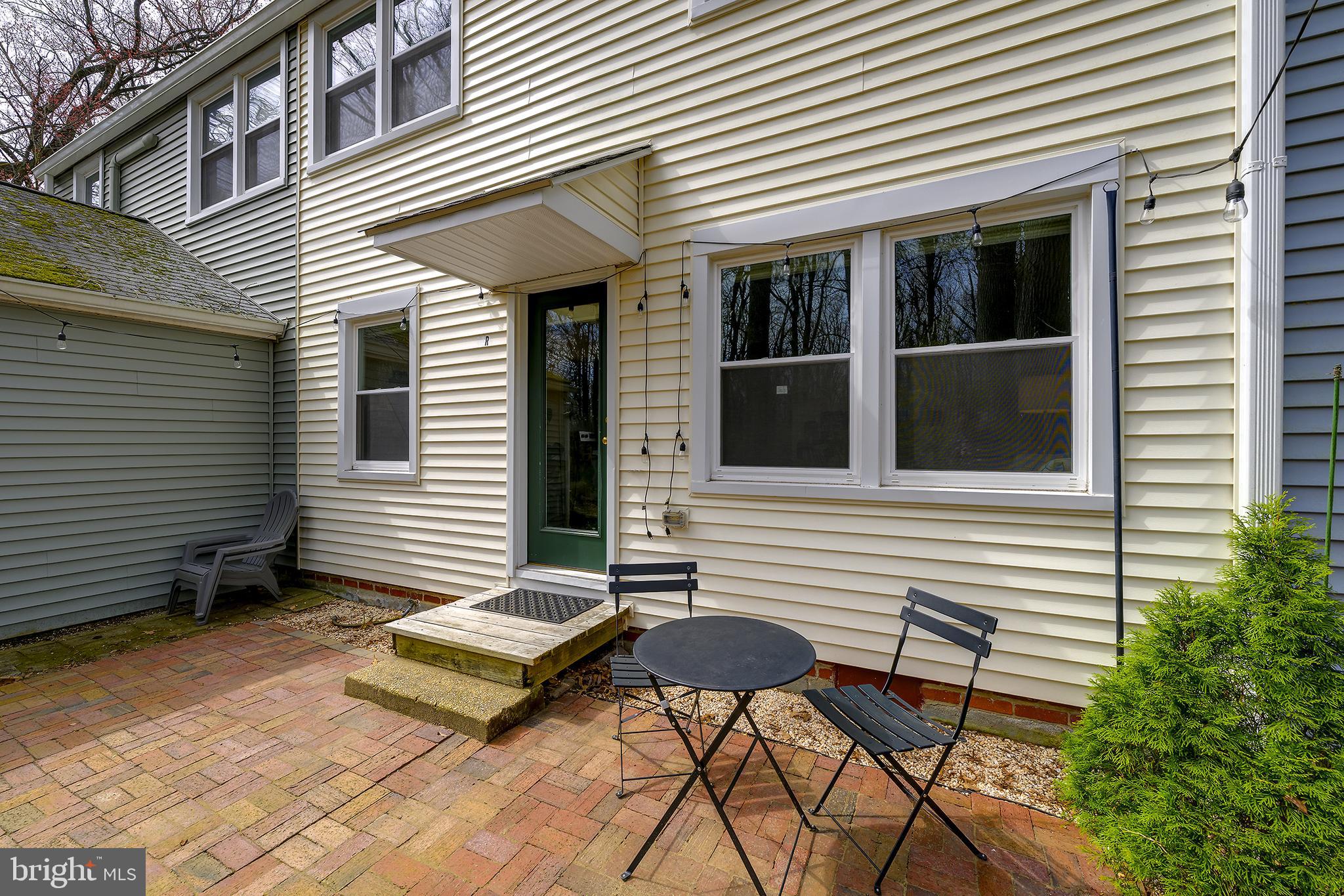 14 Laurel Hill Road Greenbelt, MD 20770 - Photo 36 of 41 a backyard of a house with table and chairs