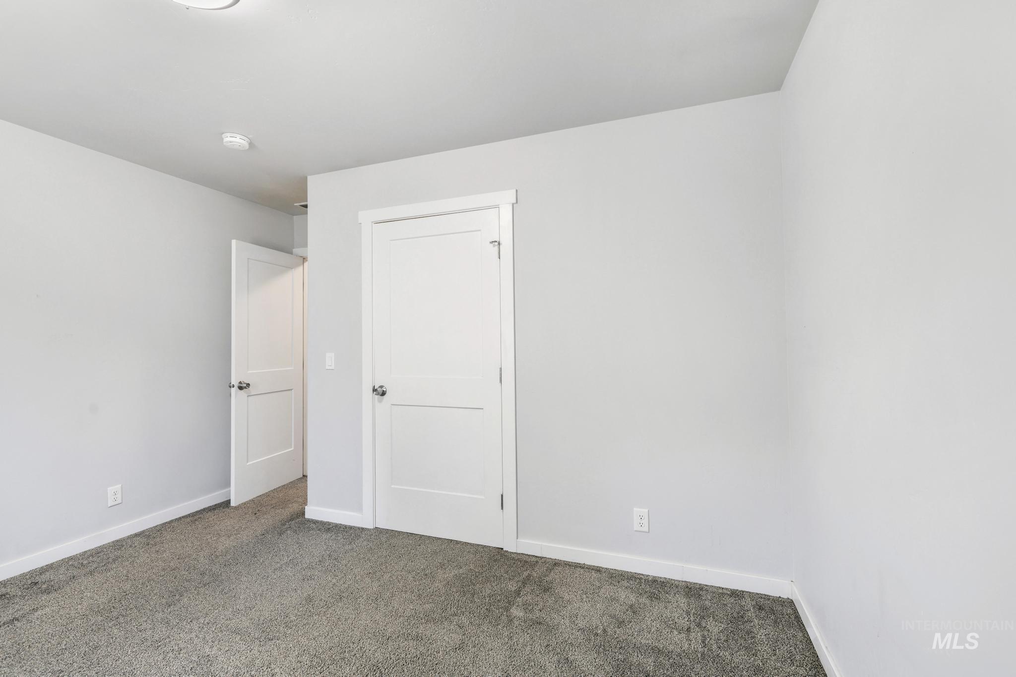 826 Normal Burley, ID 83318 - Photo 12 of 21 Neutral gray walls complement the gray carpeting