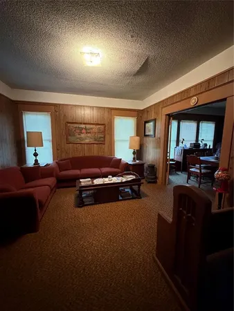 a living room with furniture window and a lamp