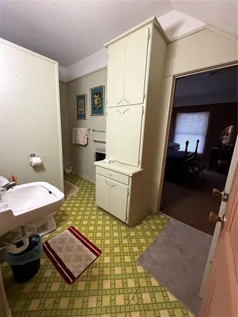 a spacious bedroom with a bed and a window