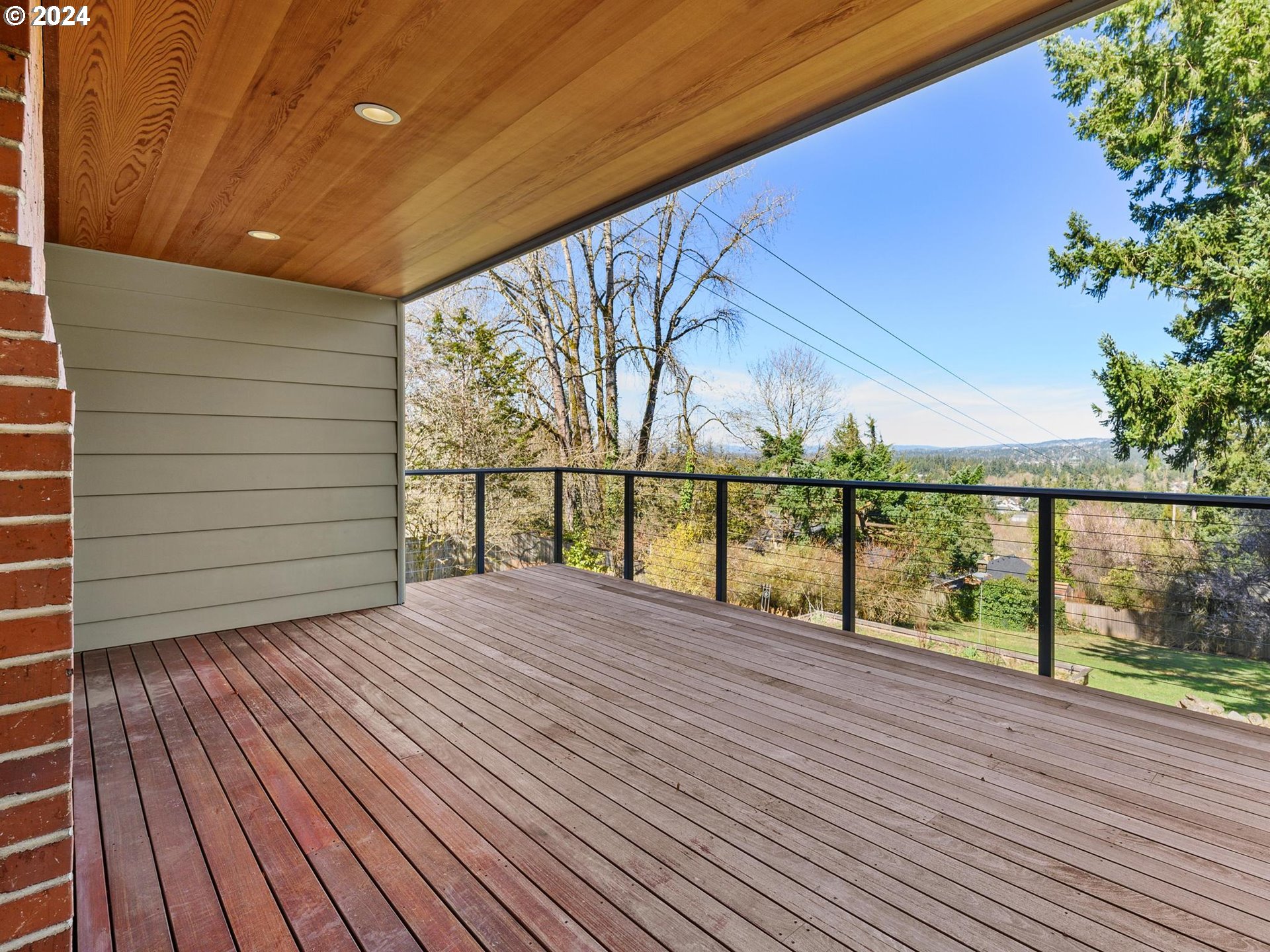 6435 Southwest Brugger Street Portland, OR 97219 - Photo 15 of 43 a view of balcony with wooden floor