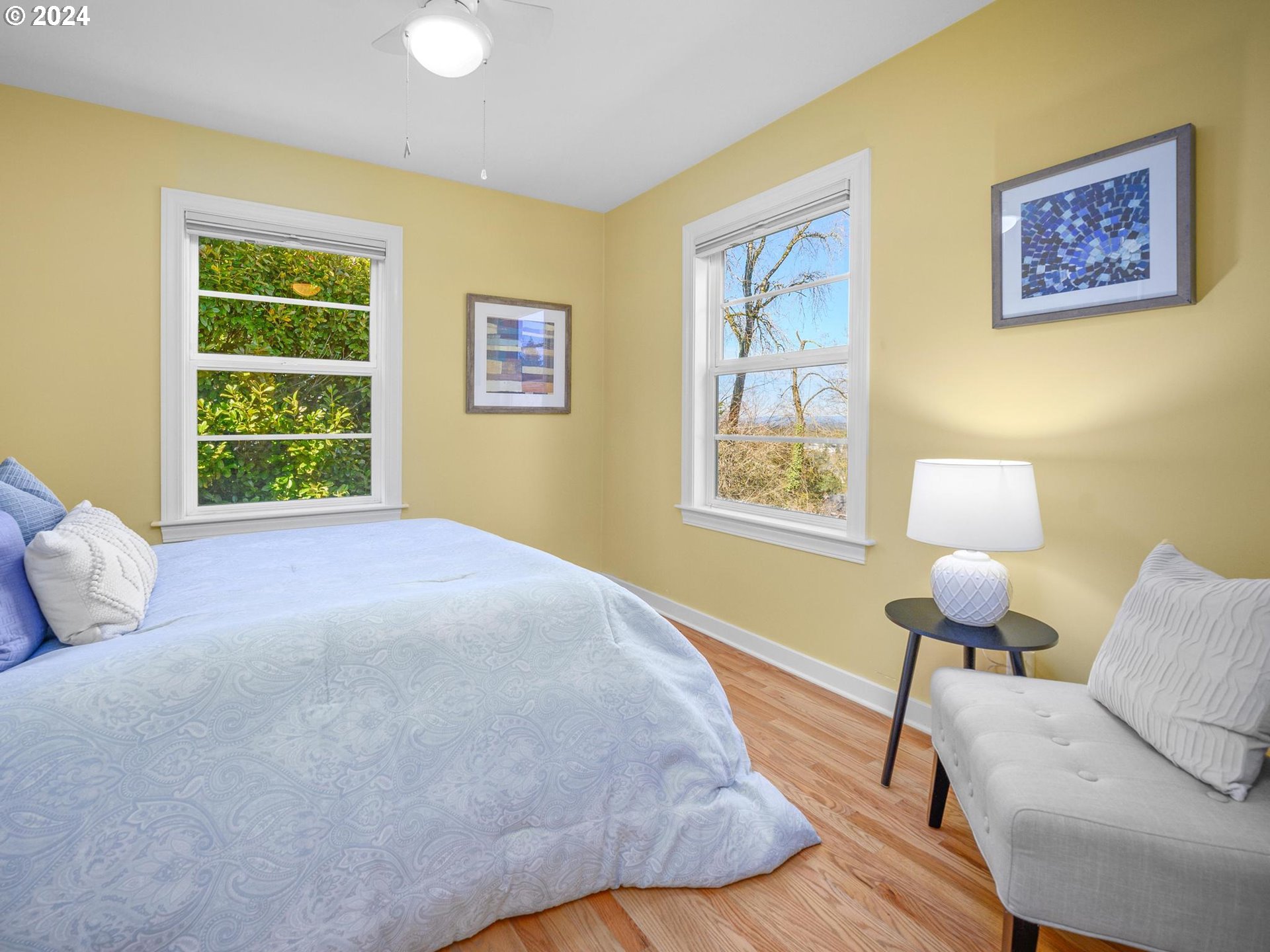 6435 Southwest Brugger Street Portland, OR 97219 - Photo 19 of 43 a bedroom with a bed and a window