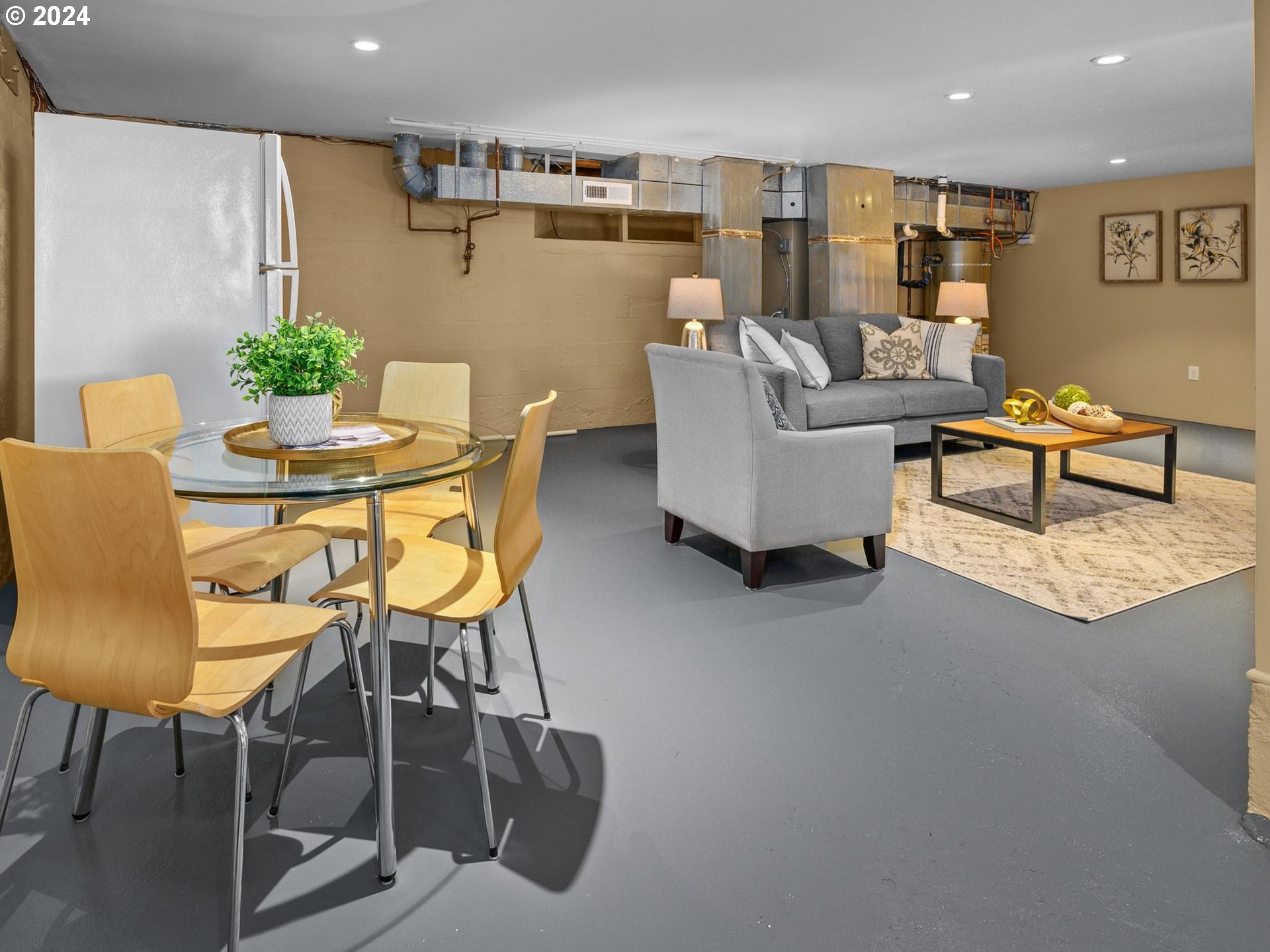 6435 Southwest Brugger Street Portland, OR 97219 - Photo 26 of 43 a living room with furniture and a table