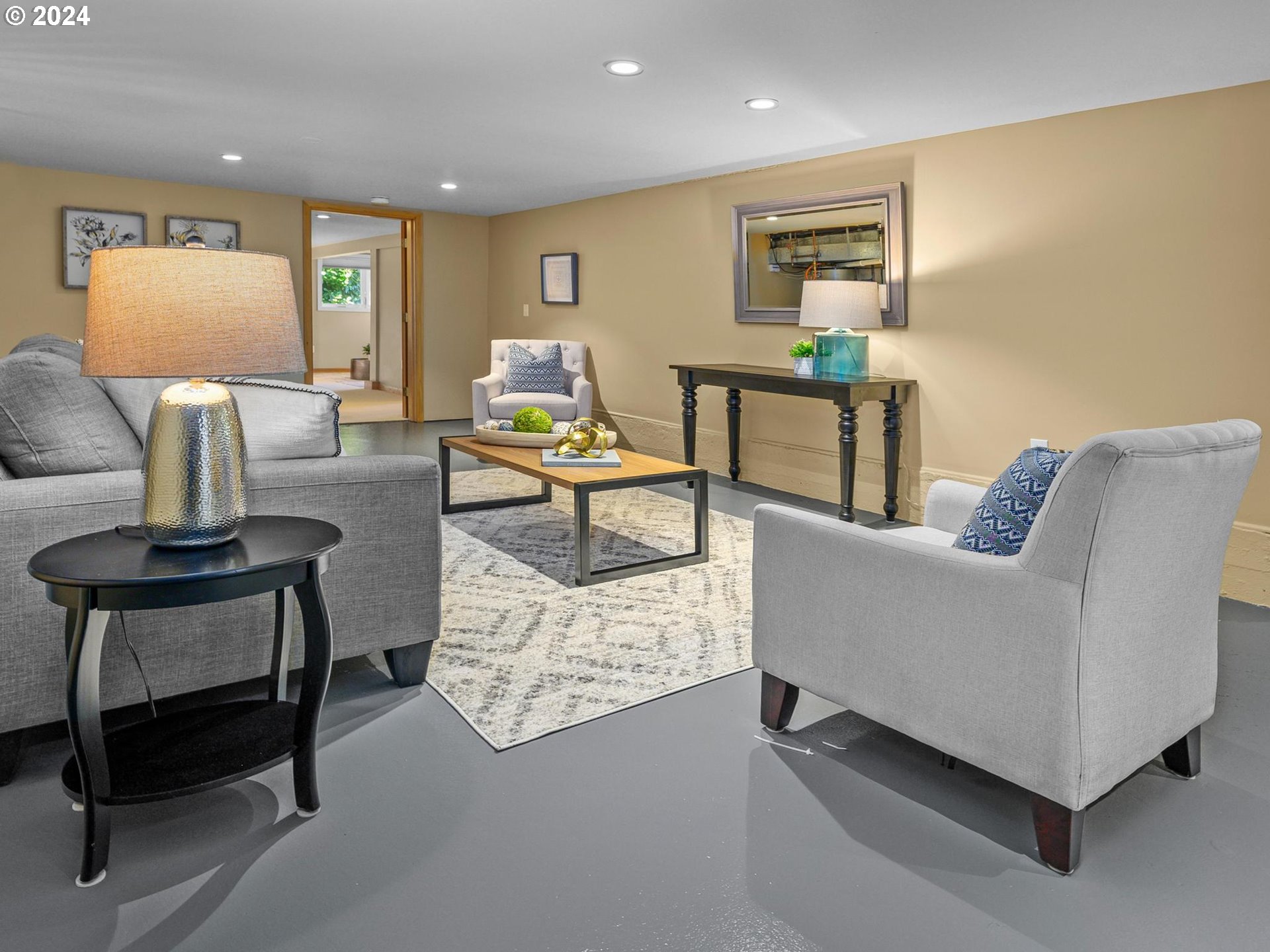 6435 Southwest Brugger Street Portland, OR 97219 - Photo 27 of 43 a living room with furniture and a table