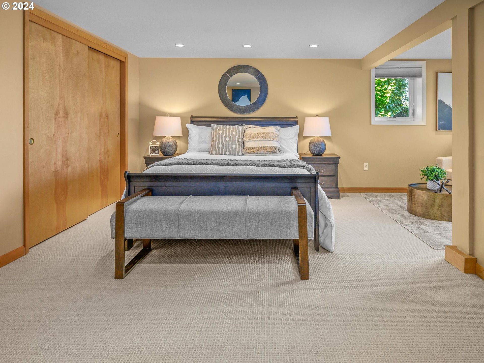 6435 Southwest Brugger Street Portland, OR 97219 - Photo 28 of 43 a bedroom with a bed and a window