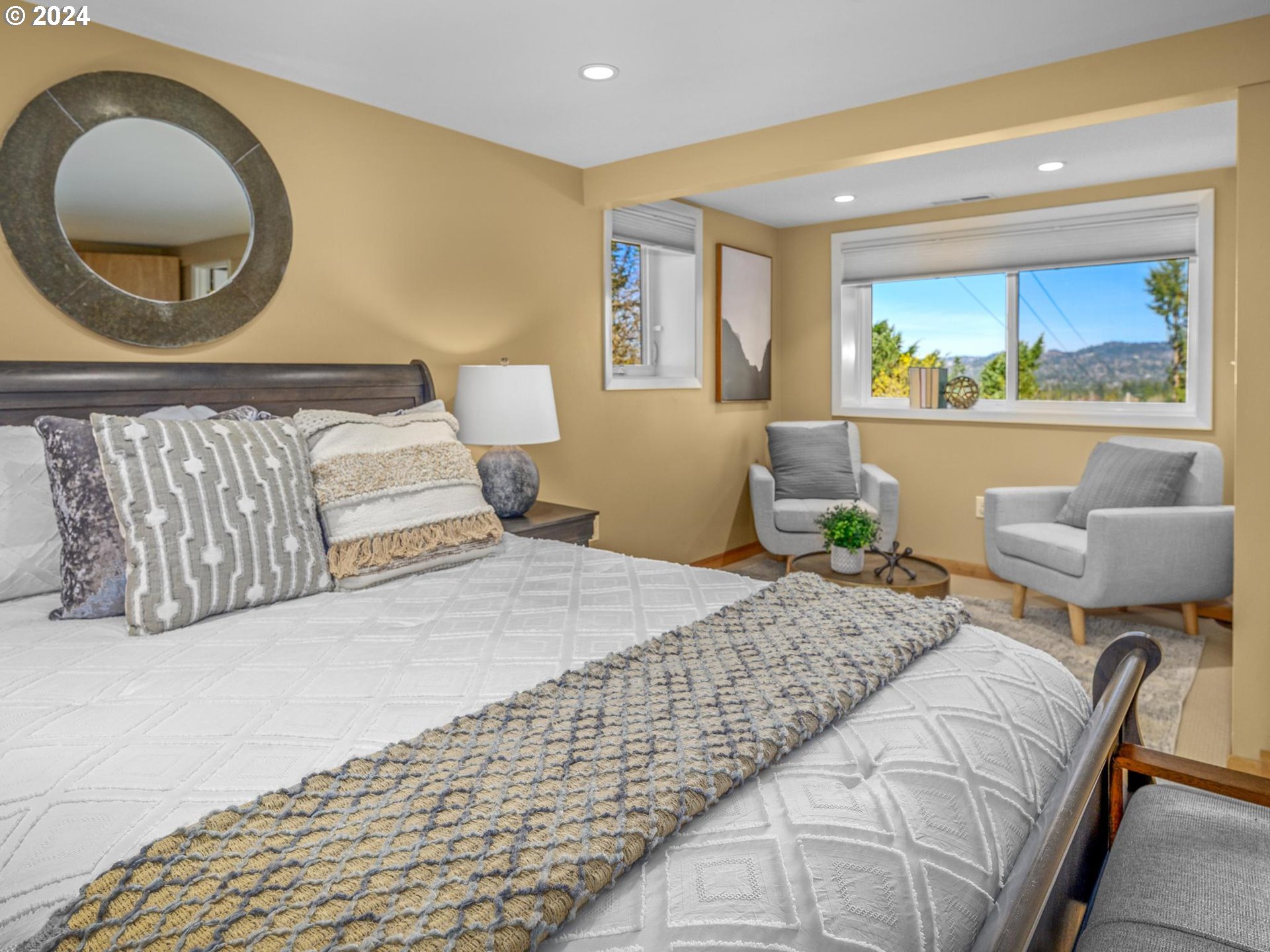 6435 Southwest Brugger Street Portland, OR 97219 - Photo 29 of 43 a bedroom with a bed and a painting on the wall