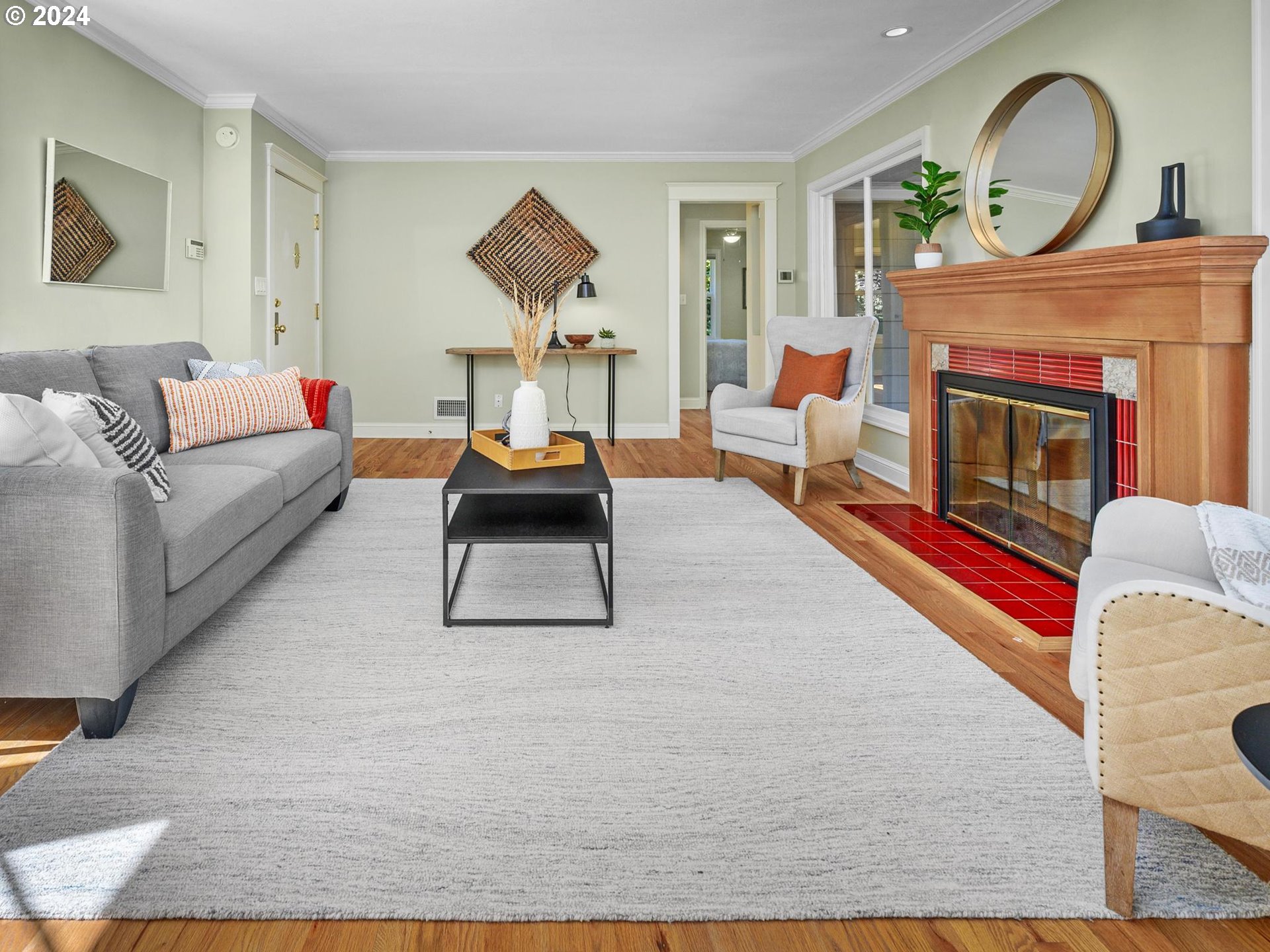 6435 Southwest Brugger Street Portland, OR 97219 - Photo 3 of 43 a living room with furniture and a fireplace