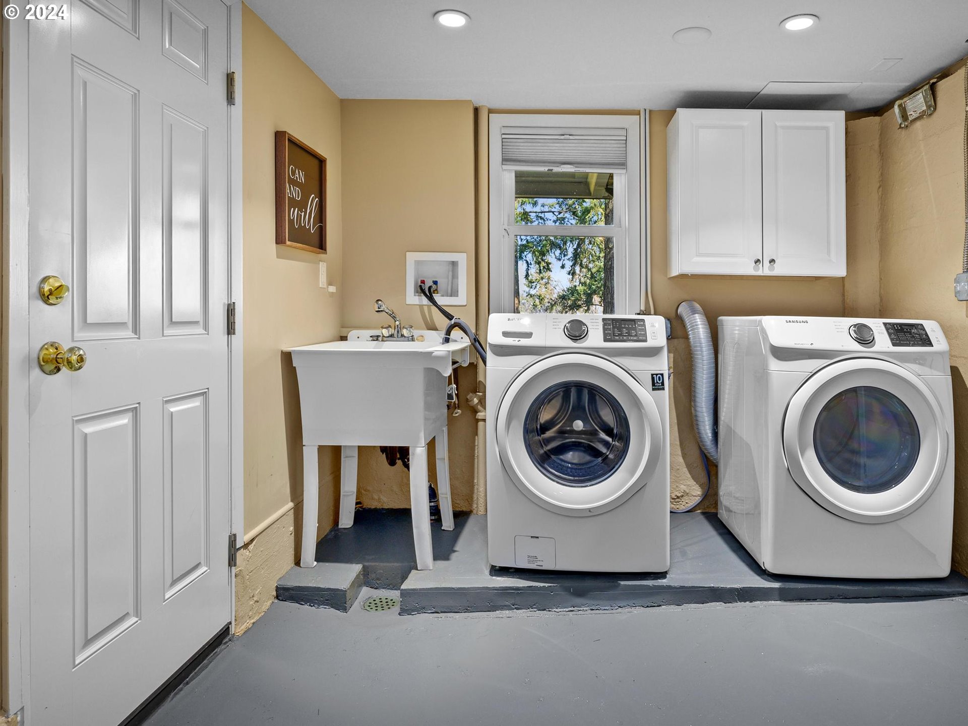 6435 Southwest Brugger Street Portland, OR 97219 - Photo 35 of 43 a utility room with sink dryer and washer