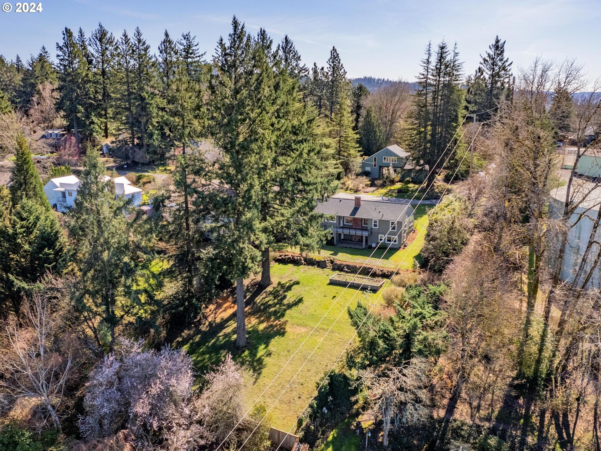 6435 Southwest Brugger Street Portland, OR 97219 - Photo 42 of 43 a view of a houses with a yard