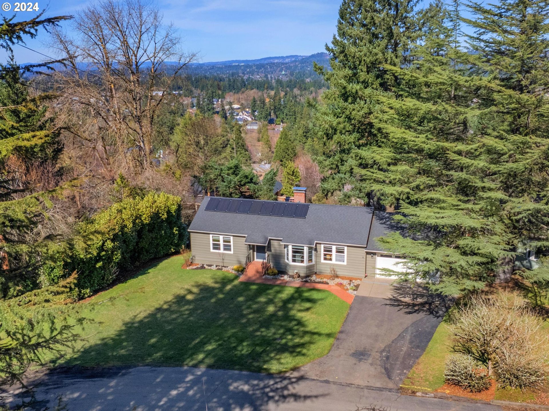 6435 Southwest Brugger Street Portland, OR 97219 - Photo 43 of 43 a aerial view of a house with a yard basket ball court and outdoor seating