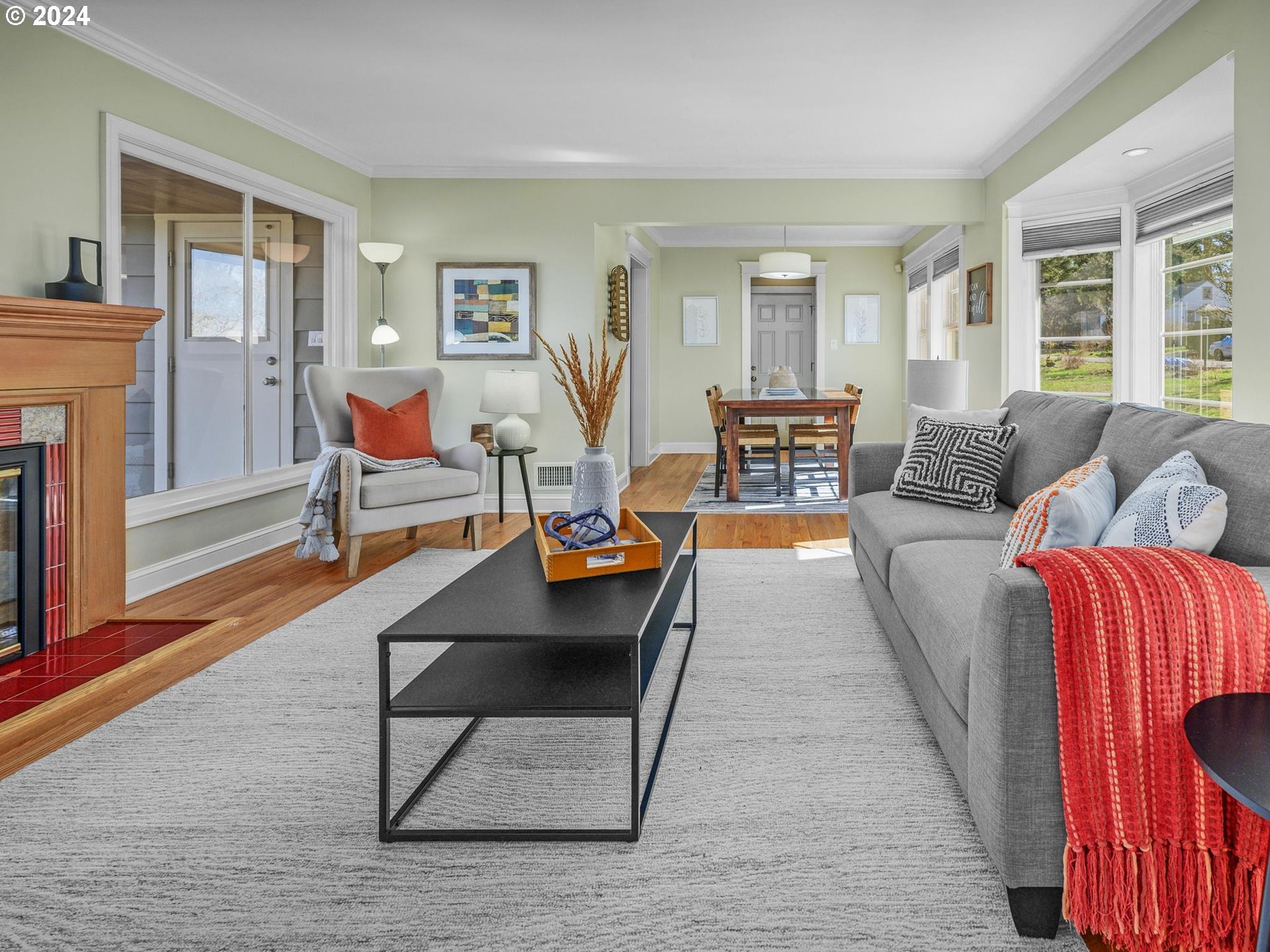 6435 Southwest Brugger Street Portland, OR 97219 - Photo 6 of 43 a living room with furniture and a fireplace