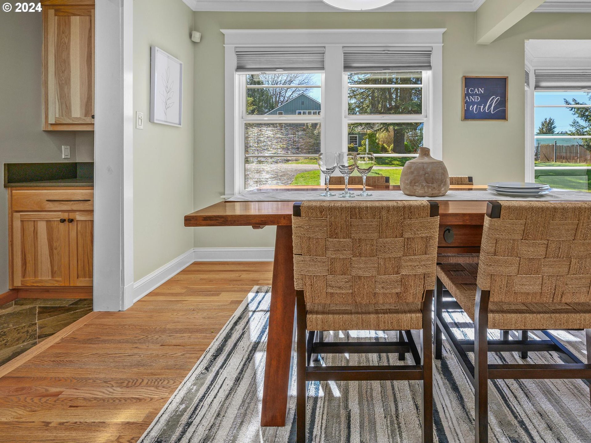 6435 Southwest Brugger Street Portland, OR 97219 - Photo 7 of 43 a living room with stainless steel appliances kitchen island granite countertop furniture and a fireplace