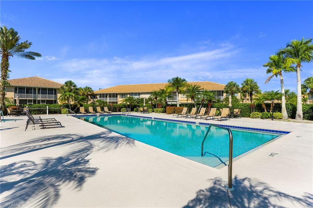 9022 Michael Circle, Unit 4 Naples, FL 34113 - Photo 27 of 28 a view of a swimming pool with a patio