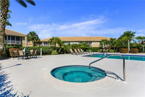 a view of a swimming pool with a patio