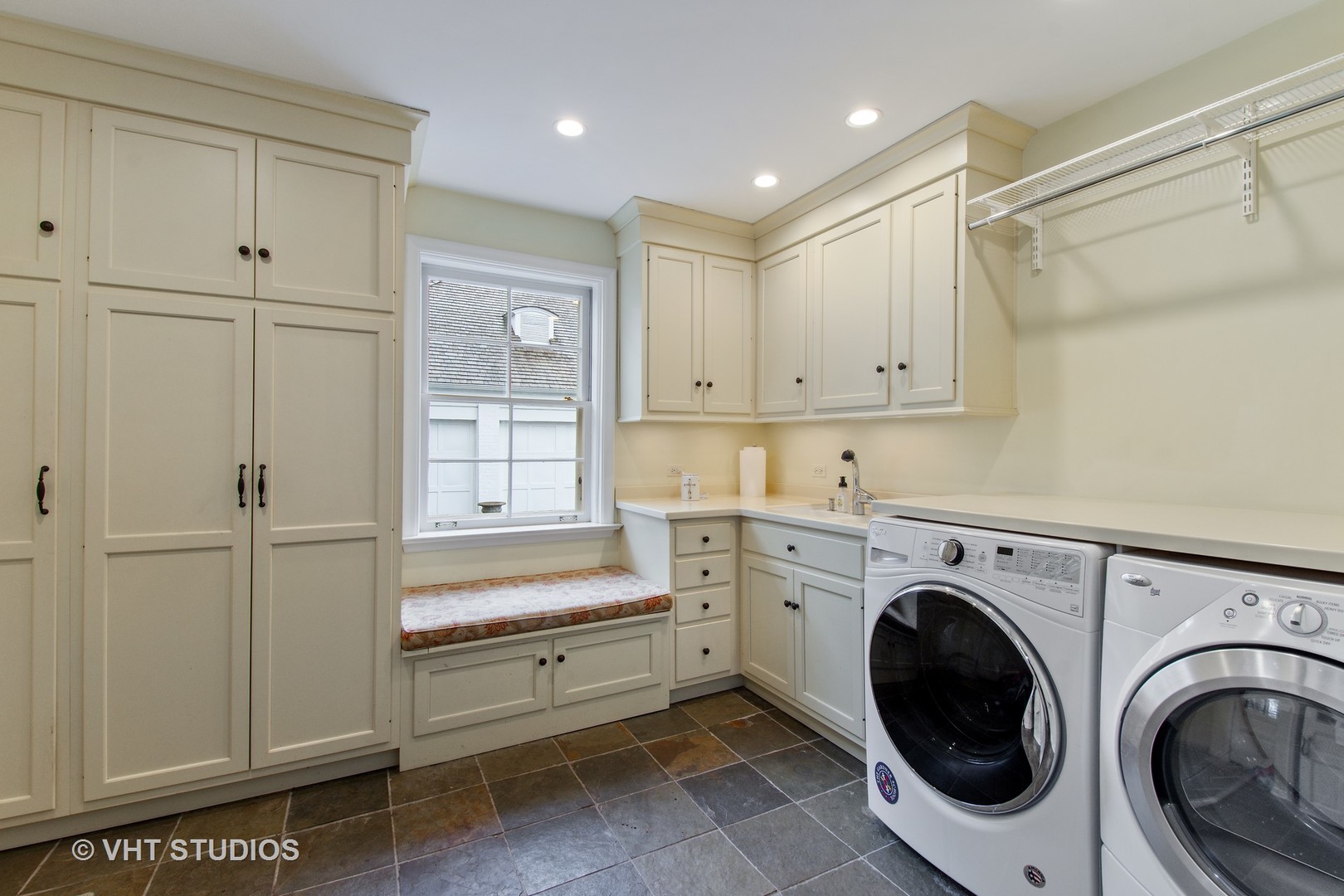 570 Aberdeen Road Inverness, IL 60067 - Photo 22 of 34 a utility room with cabinets washer and dryer
