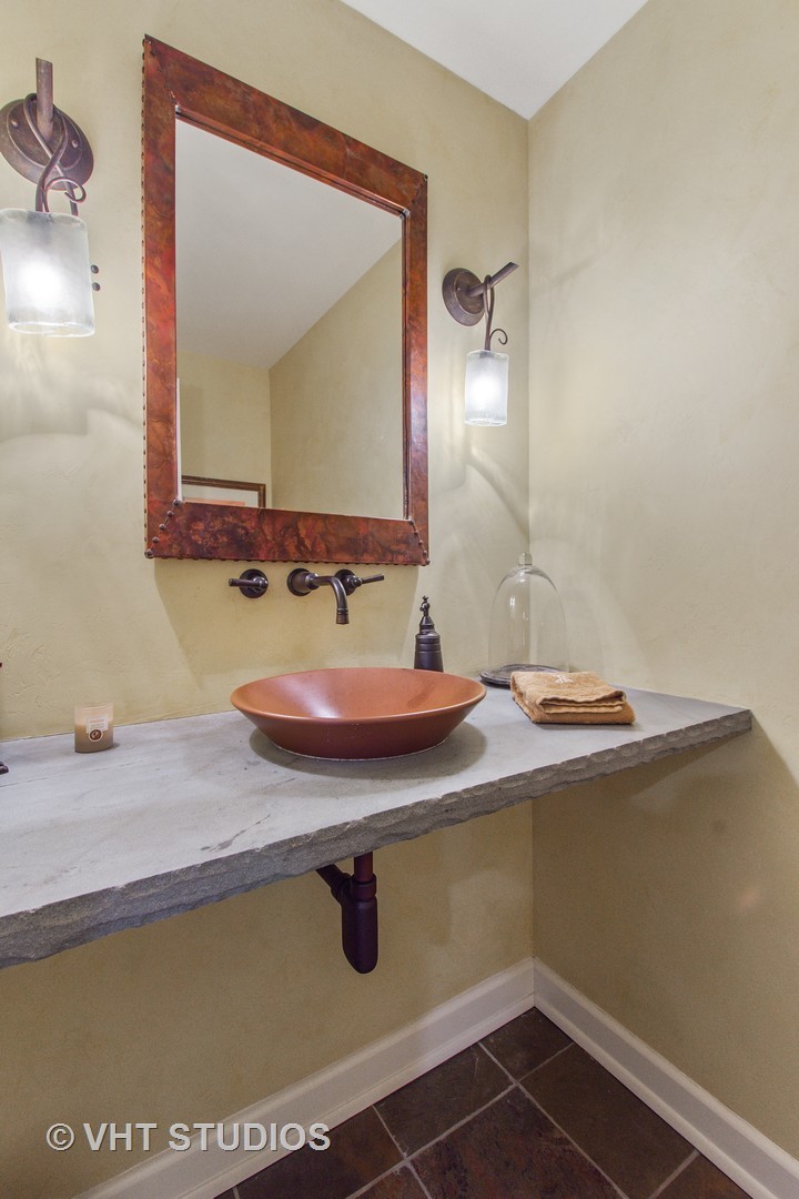 570 Aberdeen Road Inverness, IL 60067 - Photo 23 of 34 a bathroom with a sink and a mirror