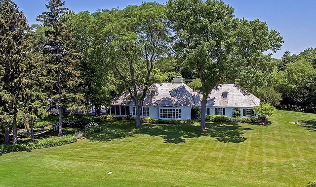 570 Aberdeen Road Inverness, IL 60067 - Photo 30 of 34 a front view of a house with a yard and large trees