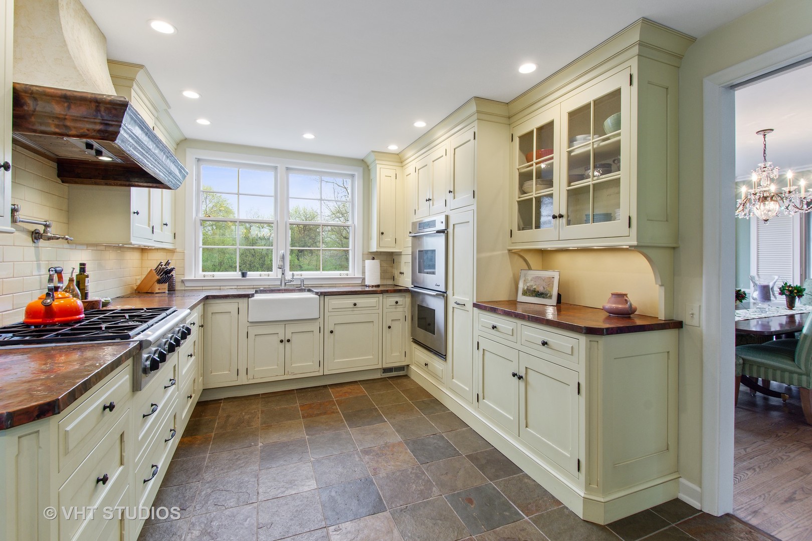 570 Aberdeen Road Inverness, IL 60067 - Photo 5 of 34 a kitchen that has a lot of cabinets in it and wooden floors
