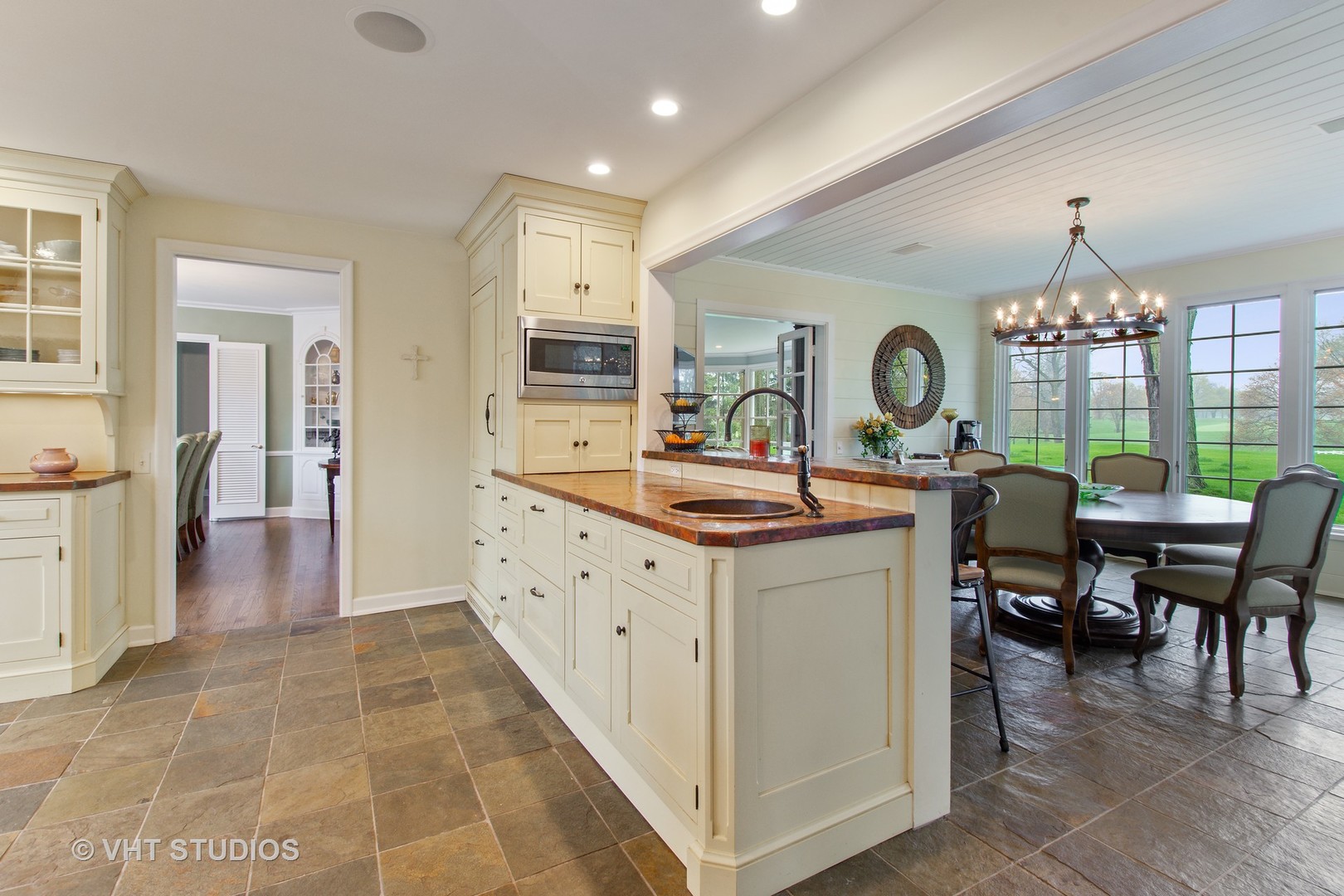 570 Aberdeen Road Inverness, IL 60067 - Photo 7 of 34 a kitchen with kitchen island granite countertop a stove and a refrigerator