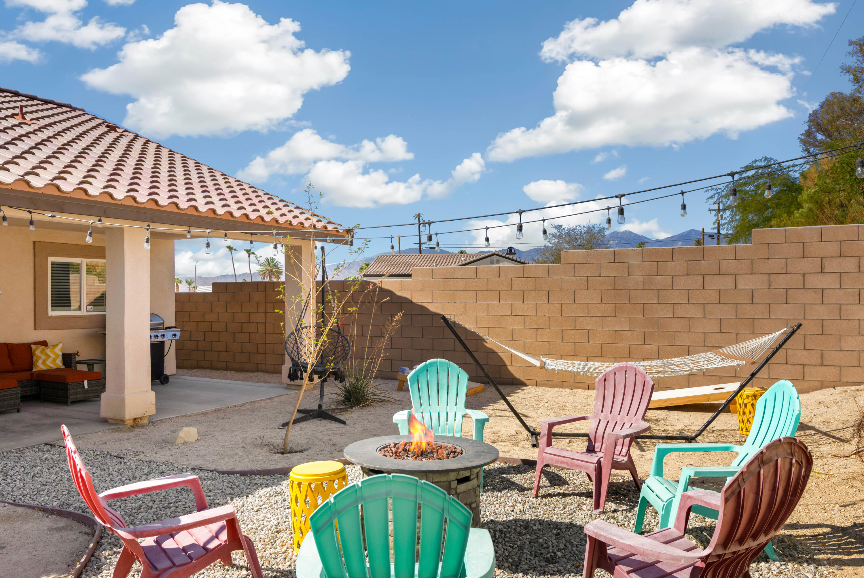 66560 Ocotillo Road Desert Hot Springs, CA 92240 - Photo 25 of 34 Backyard Firepit and seating area