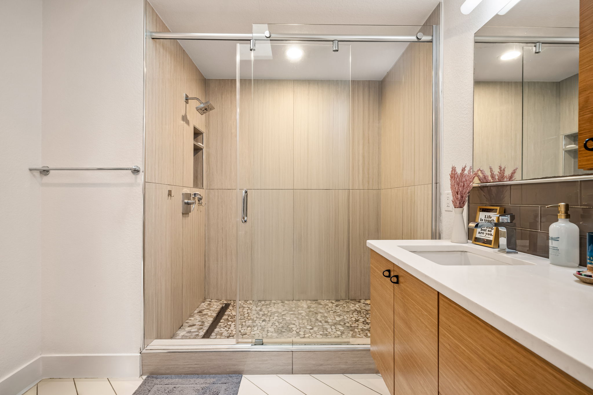 1124 Linden Street, Unit B Austin, TX 78702 - Photo 11 of 26 Full bathroom featuring vanity, light tile patterned floors, a shower stall, and backsplash