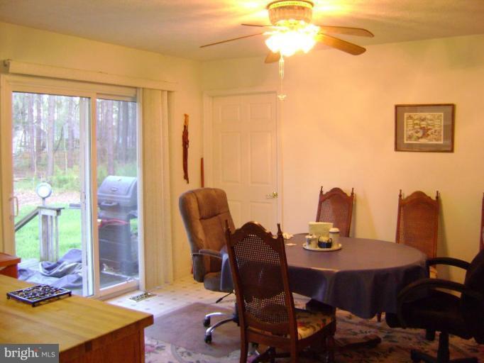 17868 Piney Point Road Tall Timbers, MD 20690 - Photo 11 of 13 a dining room with furniture and window