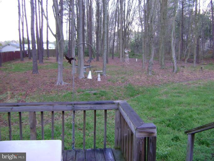 17868 Piney Point Road Tall Timbers, MD 20690 - Photo 7 of 13 a view of a deck with a backyard