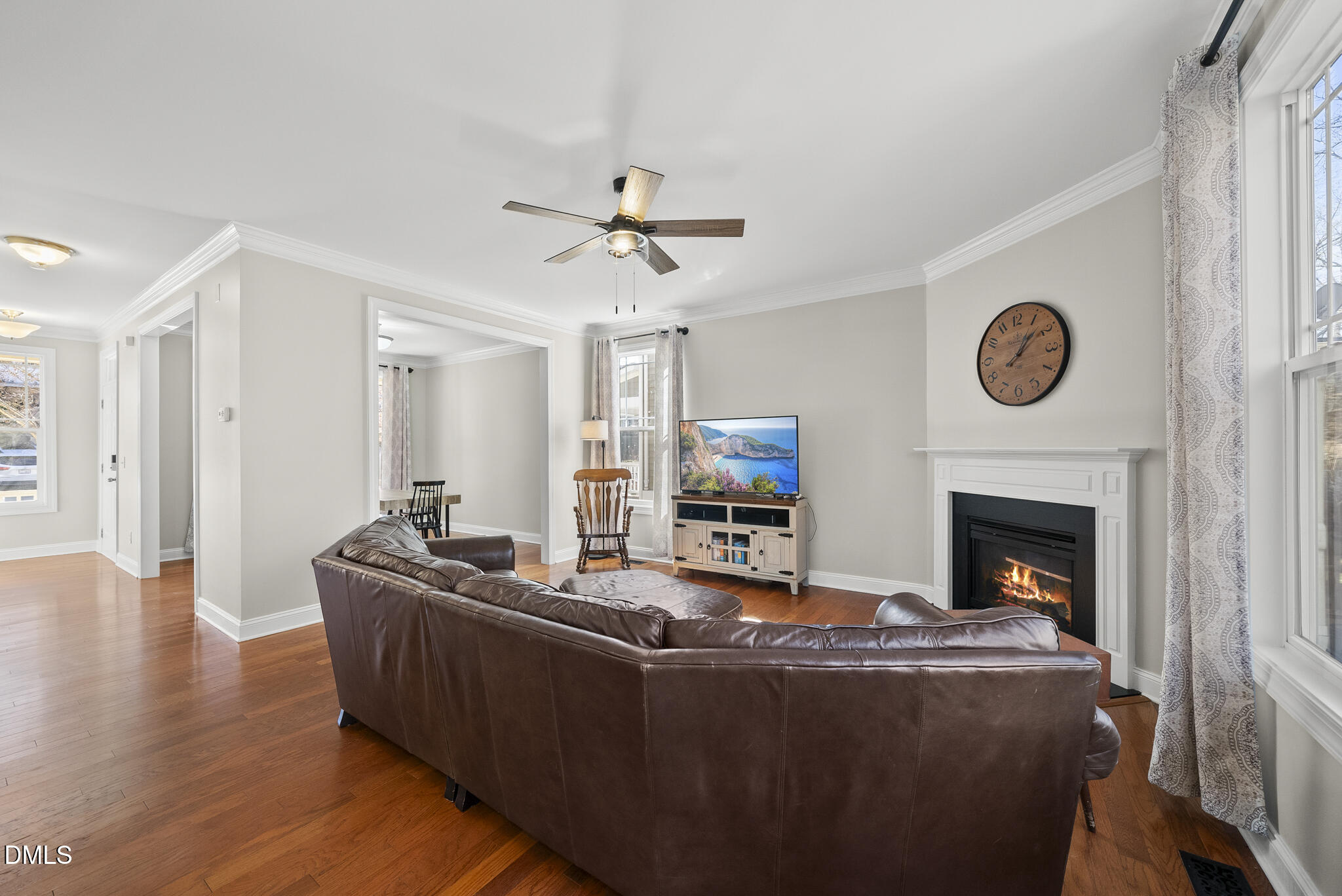 2731 Hidden Waters Circle Raleigh, NC 27614 - Photo 11 of 58 a living room with furniture a fireplace and a flat screen tv