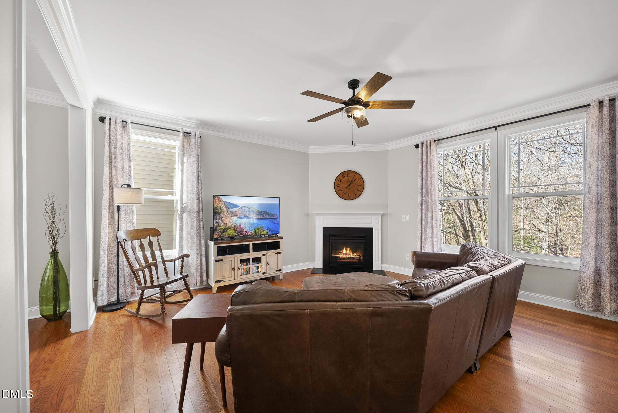 2731 Hidden Waters Circle Raleigh, NC 27614 - Photo 12 of 58 a living room with furniture a fireplace and a flat screen tv