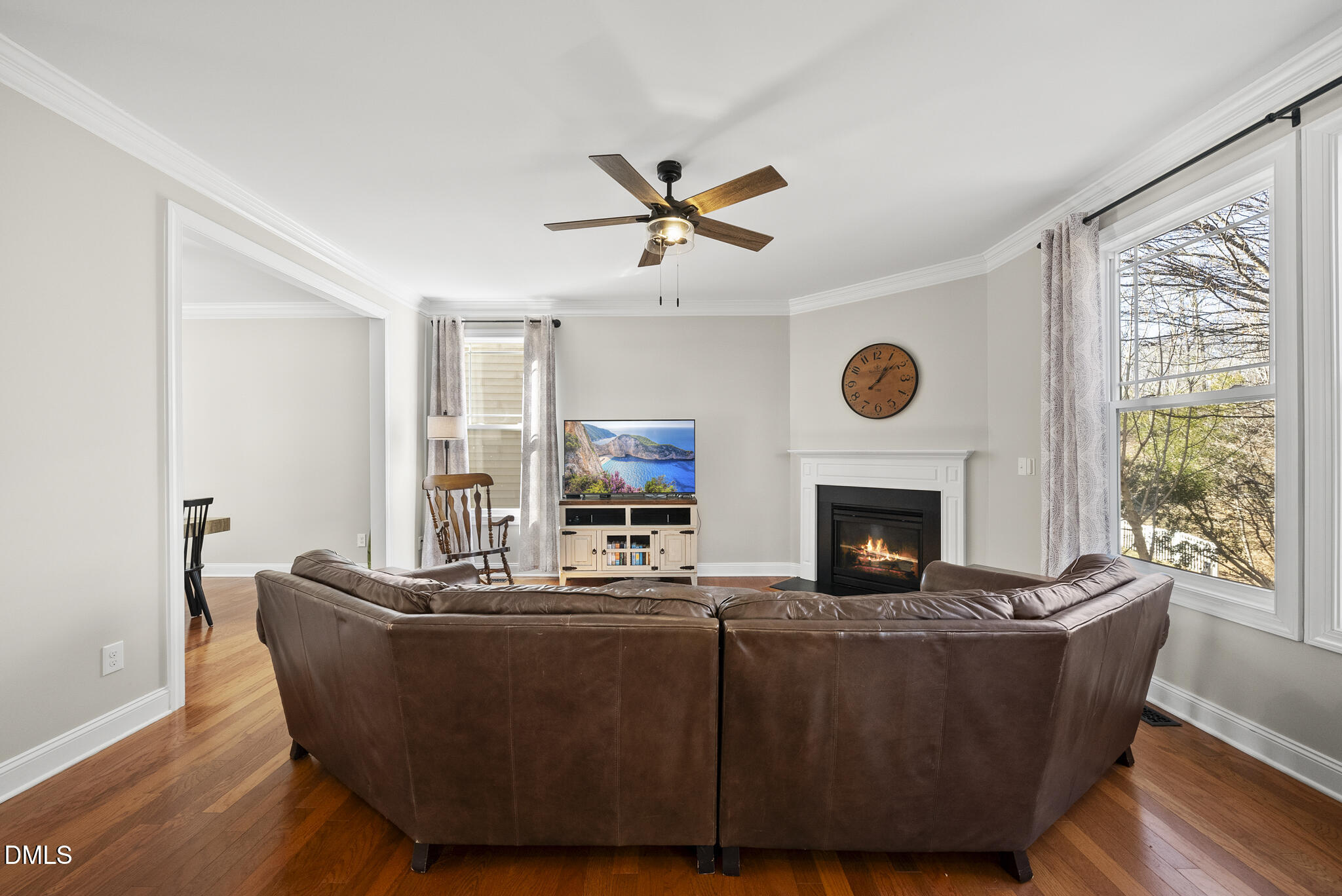 2731 Hidden Waters Circle Raleigh, NC 27614 - Photo 13 of 58 a living room with furniture a fireplace and a window