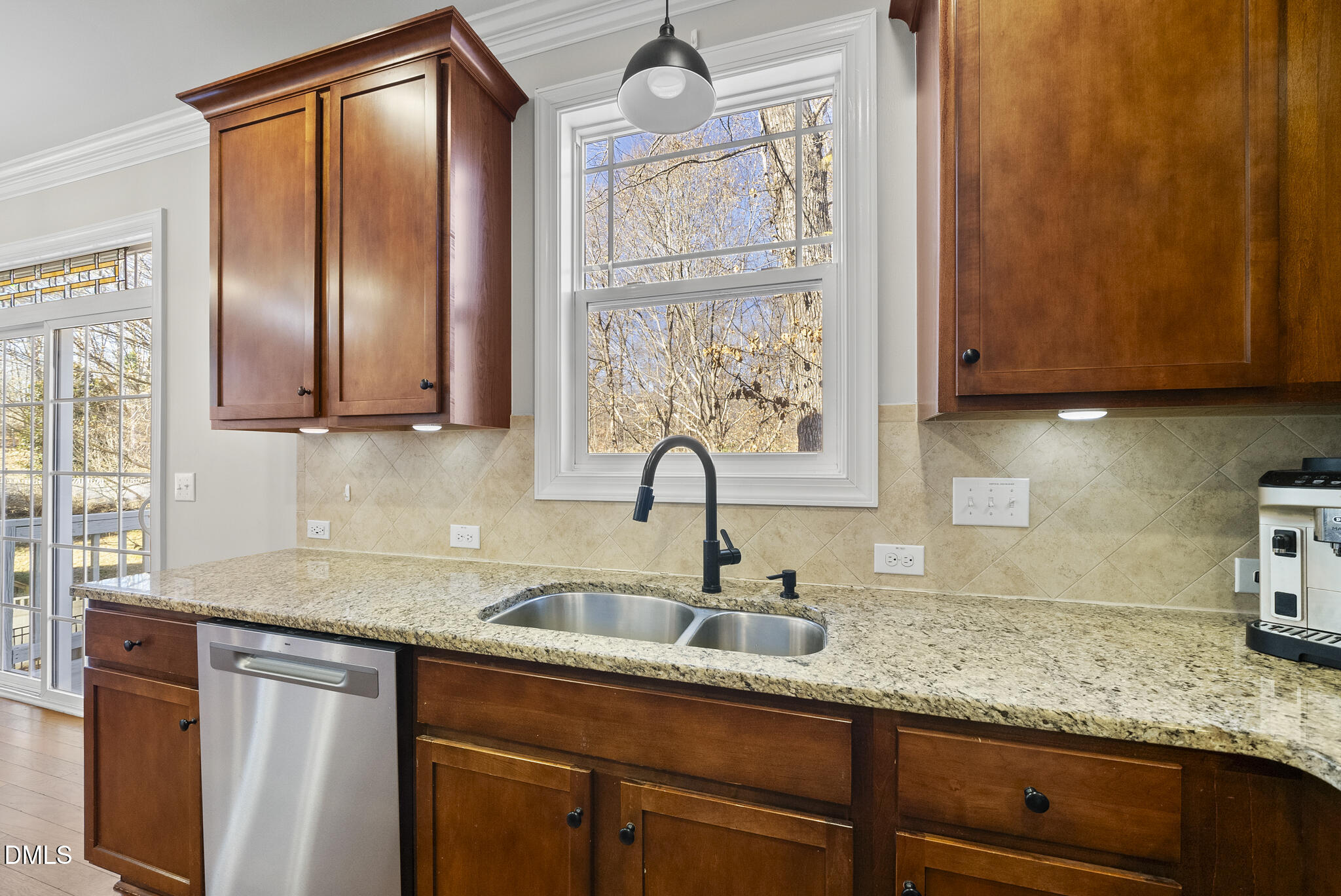 2731 Hidden Waters Circle Raleigh, NC 27614 - Photo 21 of 58 a kitchen with granite countertop stainless steel appliances a sink window and cabinets