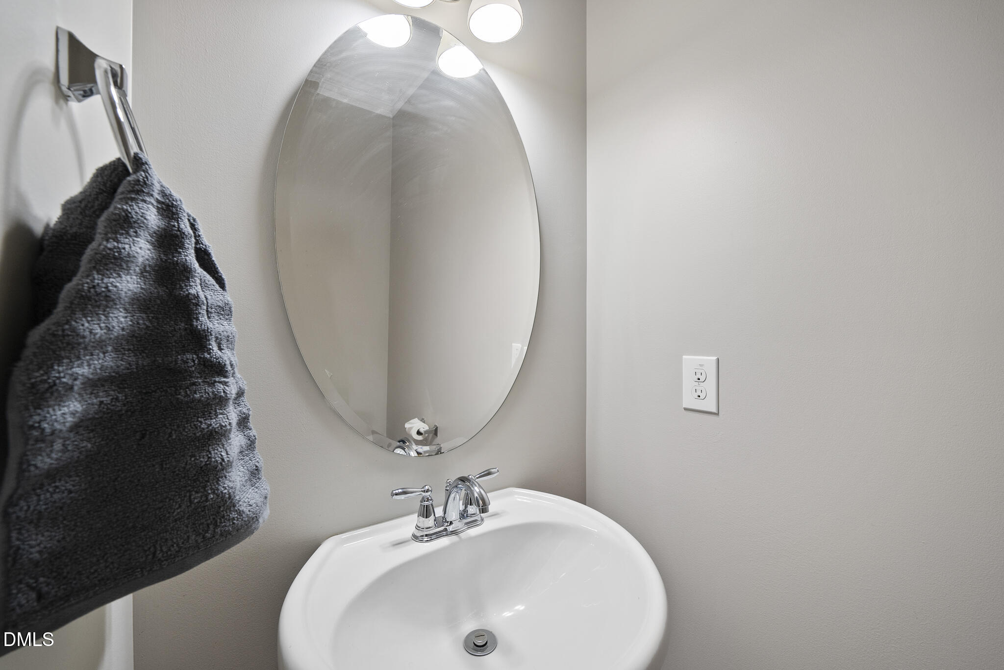 2731 Hidden Waters Circle Raleigh, NC 27614 - Photo 23 of 58 a bathroom with a sink and mirror