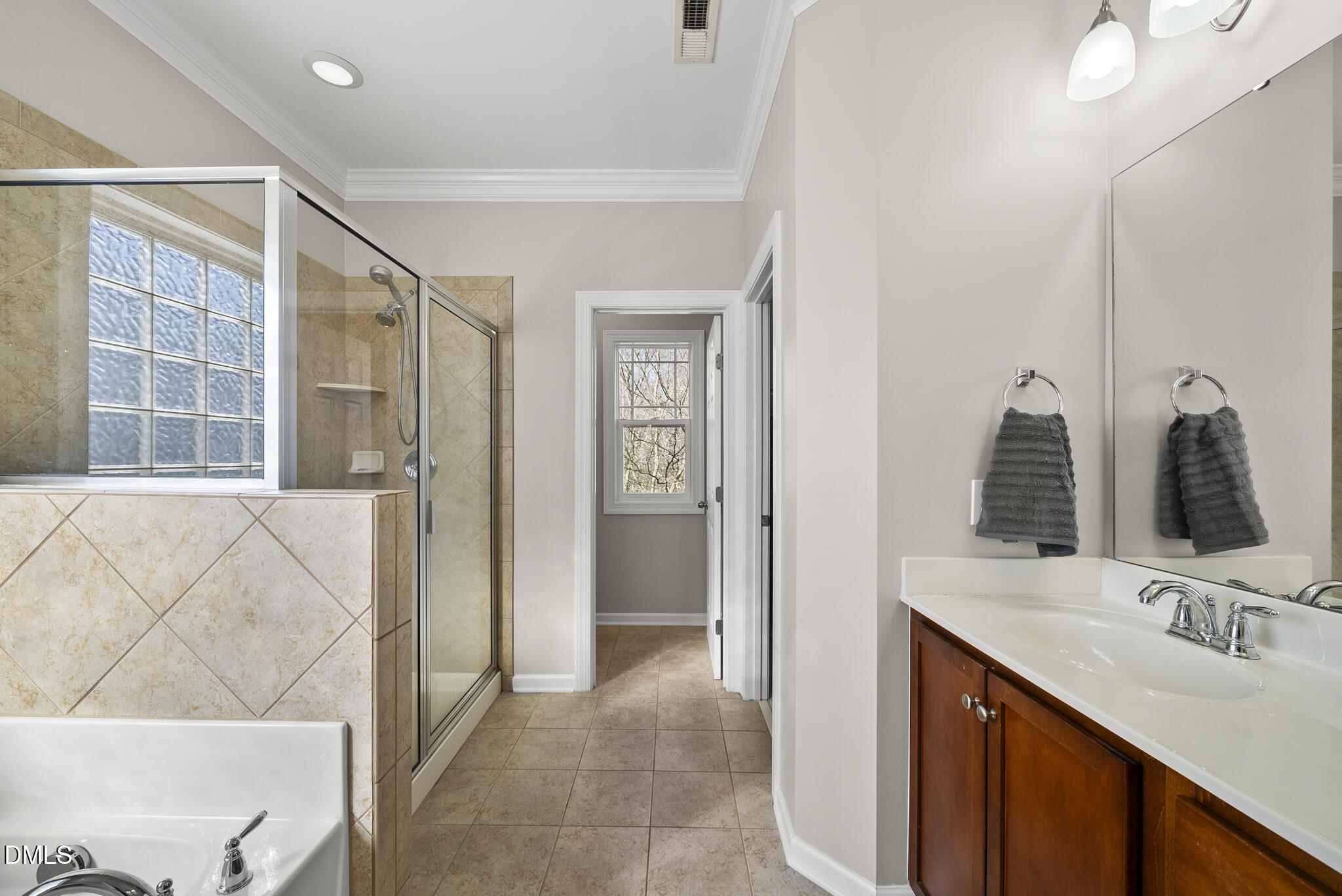 2731 Hidden Waters Circle Raleigh, NC 27614 - Photo 28 of 58 a bathroom with a sink and a mirror