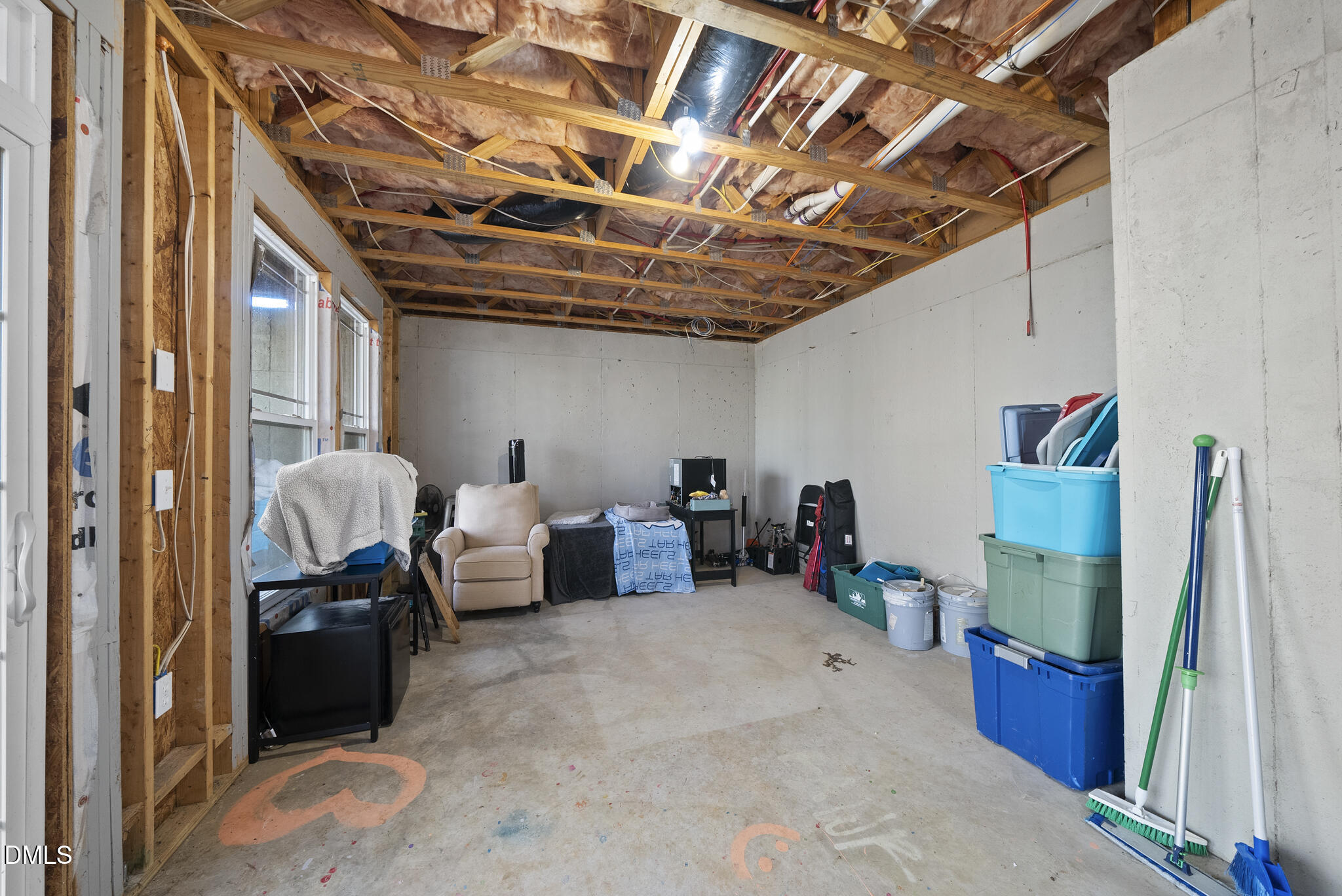 2731 Hidden Waters Circle Raleigh, NC 27614 - Photo 47 of 58 a living room with furniture and a walk in closet