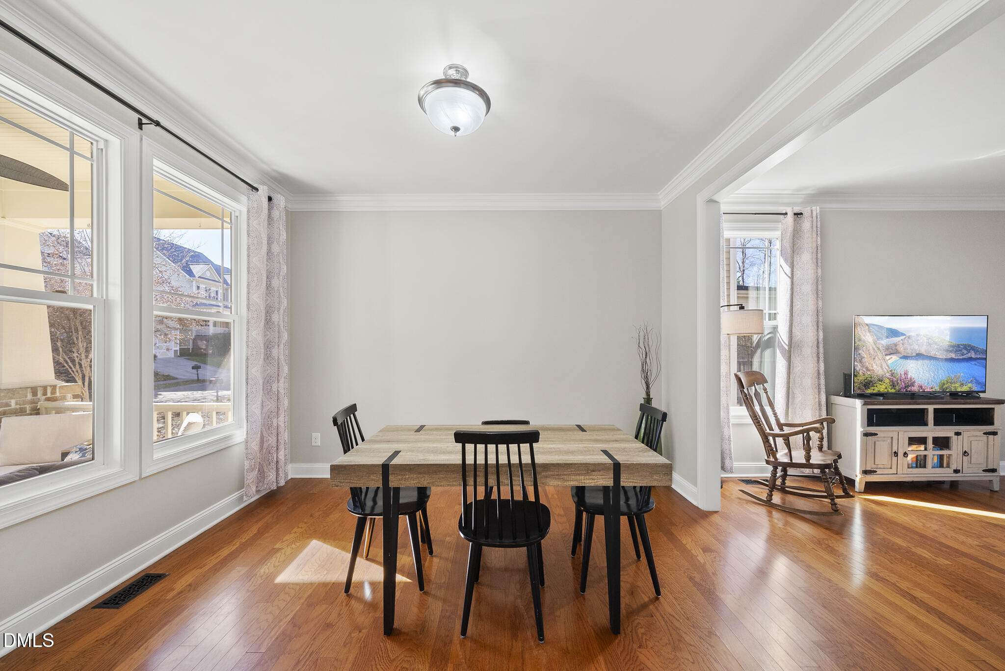 2731 Hidden Waters Circle Raleigh, NC 27614 - Photo 9 of 58 a view of a dining room with furniture a chandelier and wooden floor