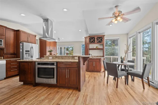 a view of a large garden with plants and large trees