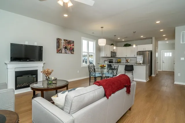 a living room with furniture and a fireplace