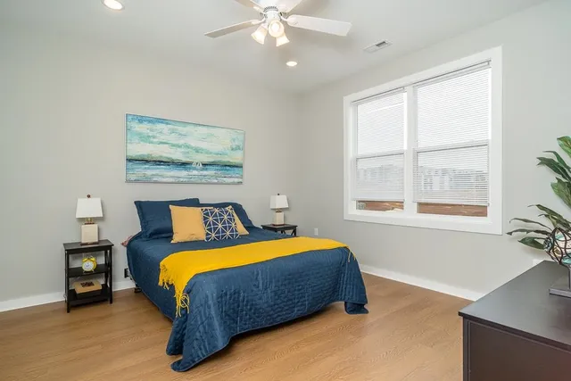 a bedroom with a bed and window