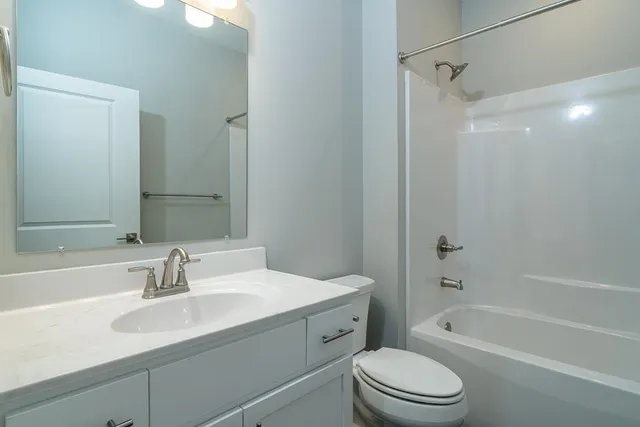 a bathroom with a sink a toilet and a bathtub