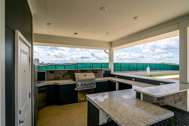 a view of swimming pool with a patio
