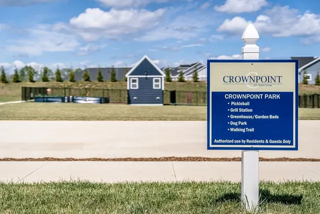 a view of a chair in the back yard of a house