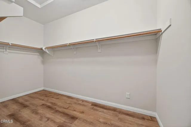 a view of a room with shelf on the wall