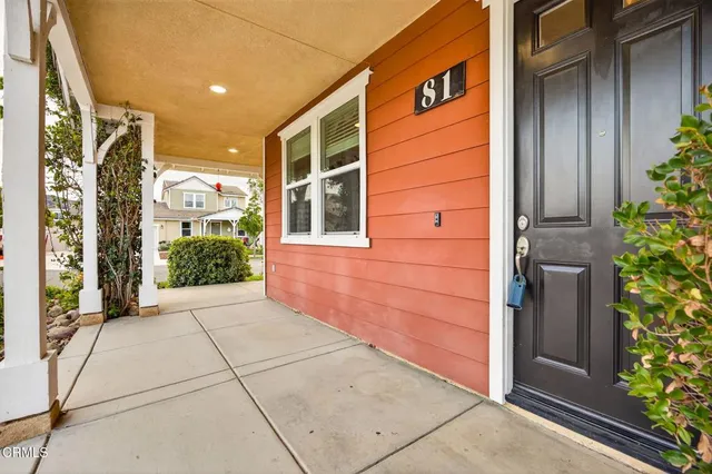 front view of a brick house with a large windows