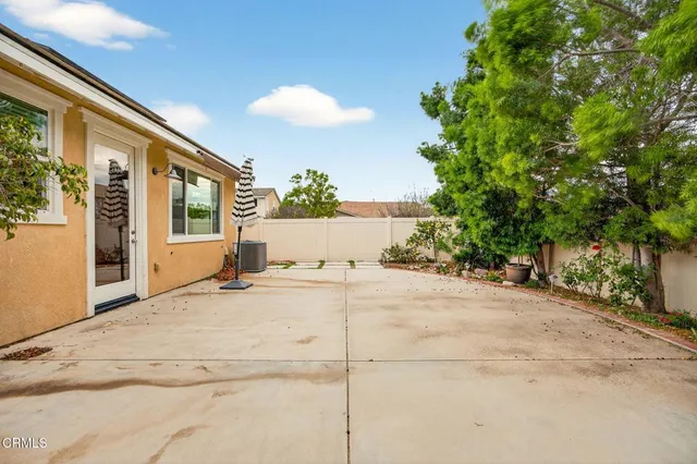 a view of a house with a yard and garage